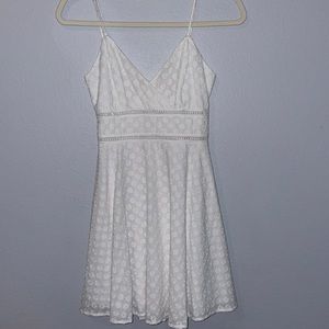 White dress with embroidered flowers